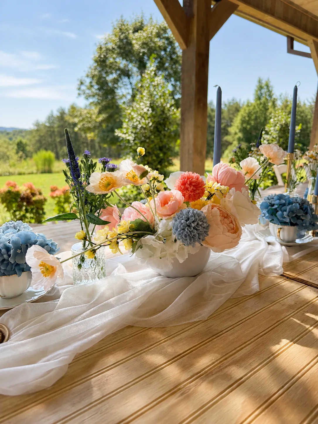 Porch tablescape with peach & blue florals